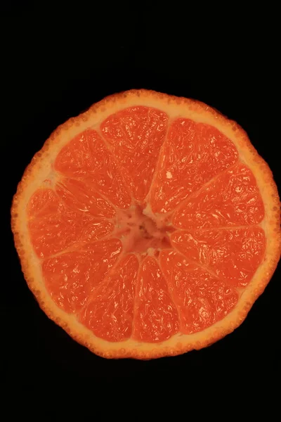 orange slice on black background