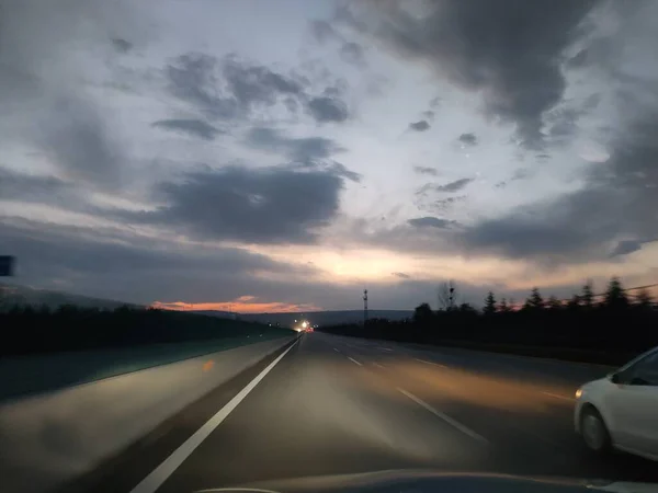 driving car at sunset