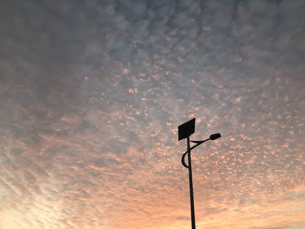 street lamp on the background of the sunset