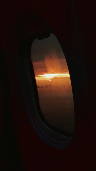 airplane window with sun rays