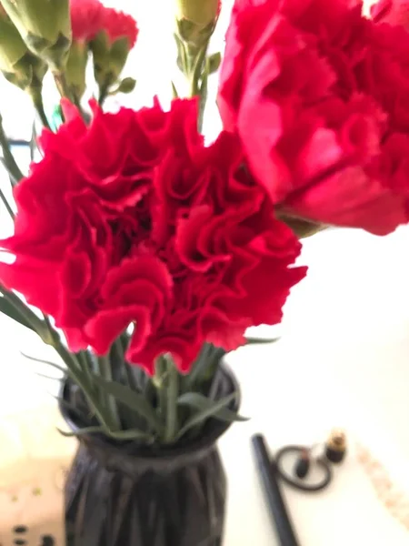 beautiful bouquet of red roses in a vase on a white background