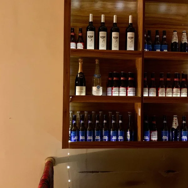 empty wine bottles in a row