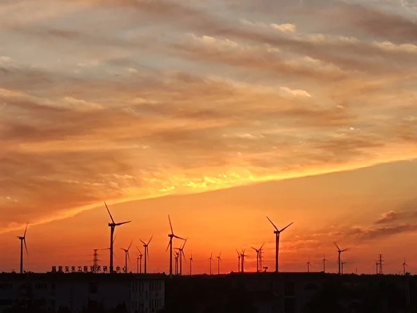 wind turbine in the sunset sky