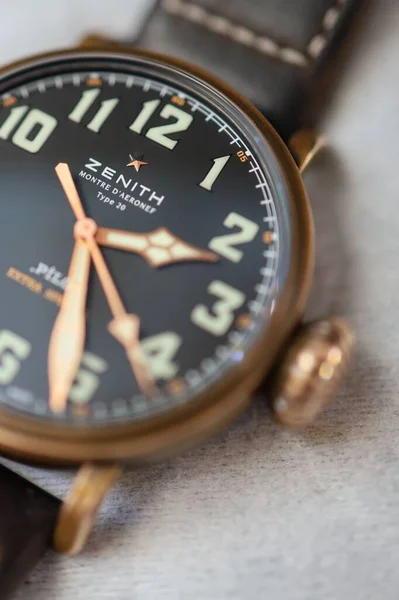close up of a vintage watch on a wooden background