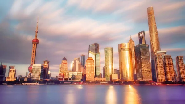 shanghai skyline with modern city at sunset