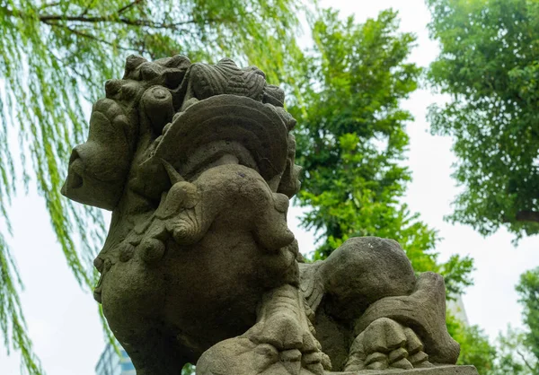 sculpture of a lion statue in the park