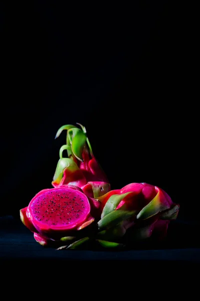 dragon fruit on black background