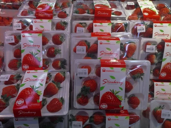 red and white strawberries in the store