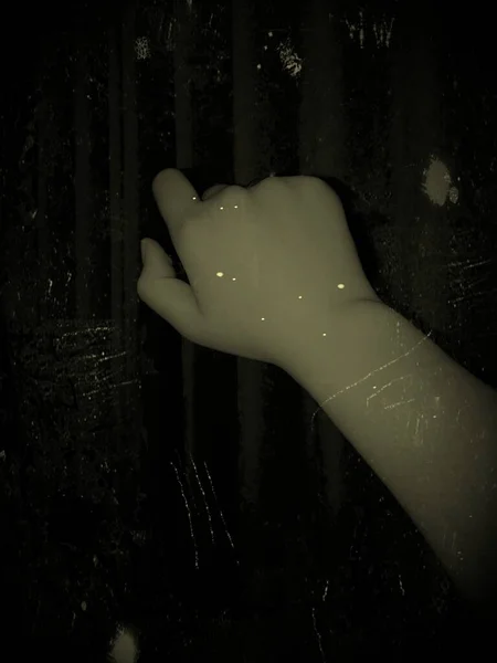 woman's hands with a black background