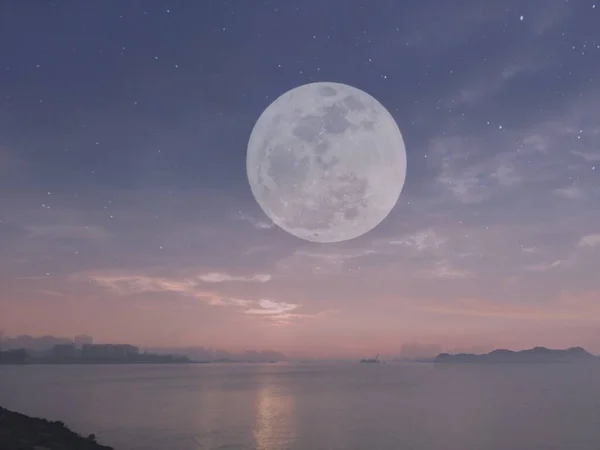 full moon over the sea at night