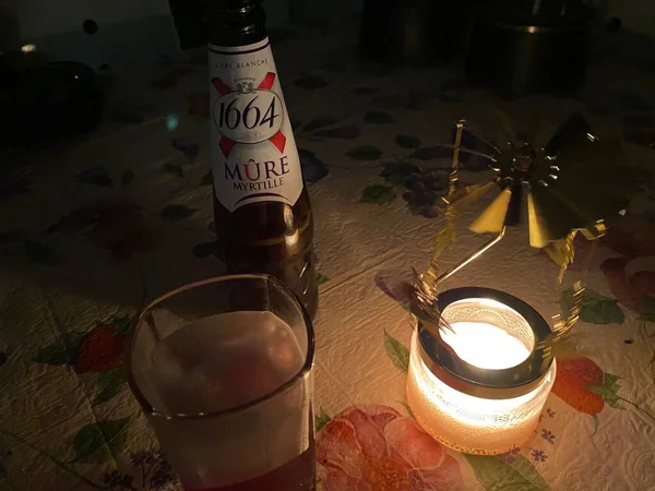 wine glass with red candles and a candle