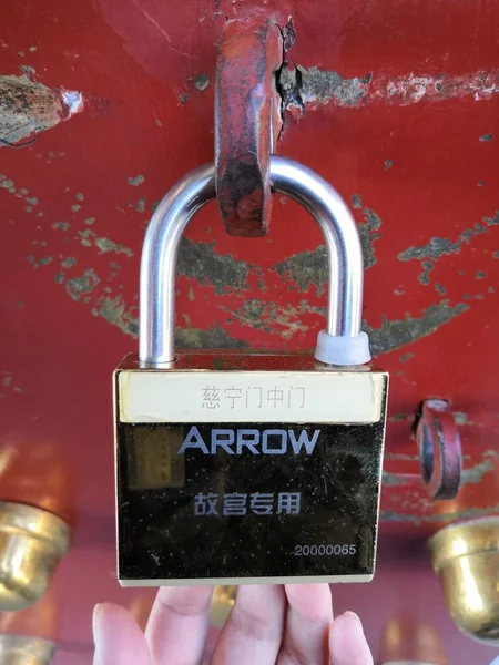 padlock on the background of the old wall