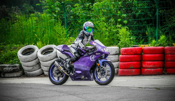 young woman riding a motorcycle in the city