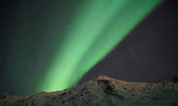 northern lights over the arctic mountains