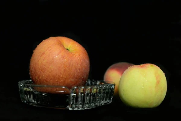 apple and apples on a black background
