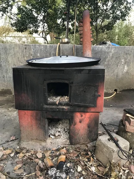 old rusty metal container with a fire