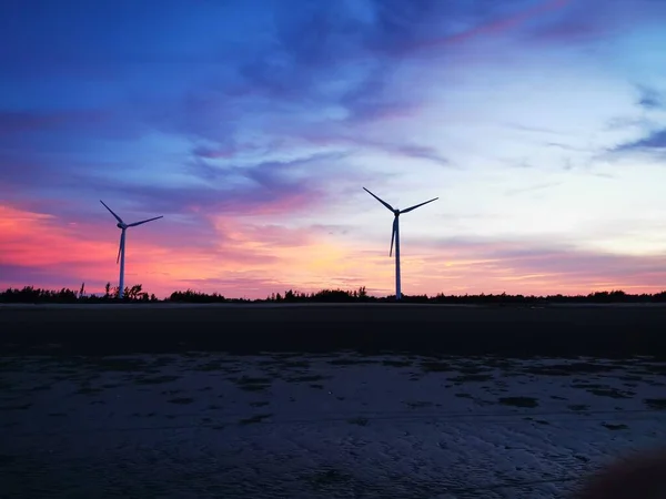 wind turbine in the sunset