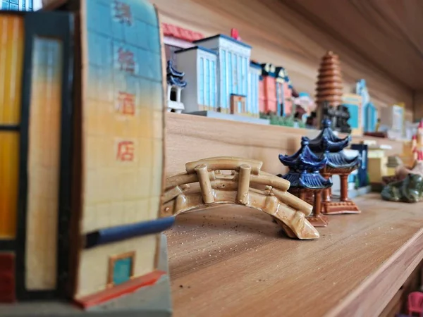 wooden toy house in the background