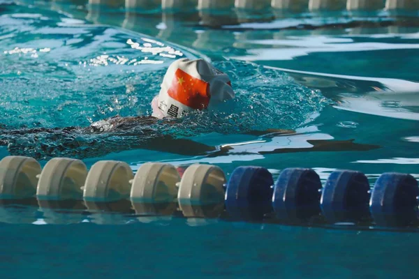 swimming pool with water and ball