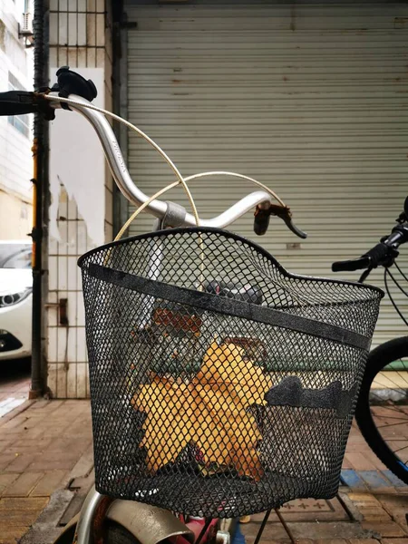 street shopping cart with basket and bicycle
