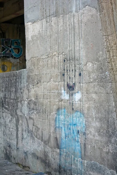 old stone wall with a large pattern of a concrete walls