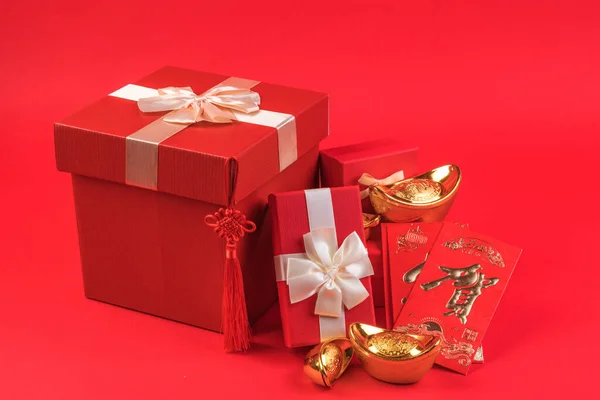 christmas gift boxes with red bow and ribbon on a yellow background.