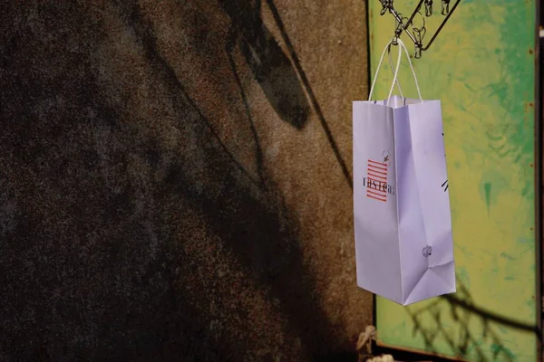 shopping bag with a paper bags on a background of a wall