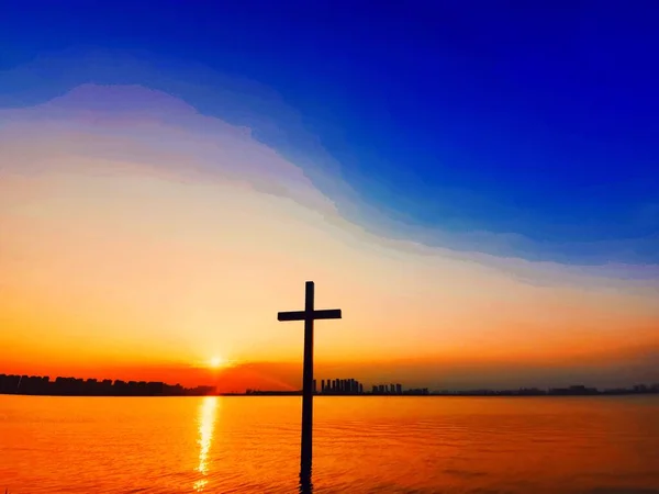 christian cross on the sunset