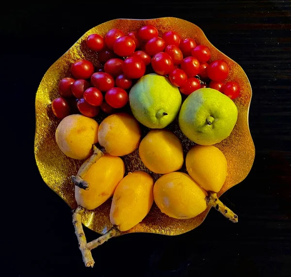 fruits and vegetables on a black background