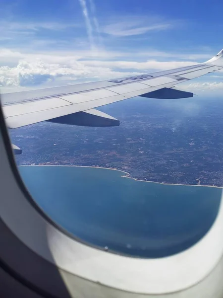 view of the airplane wing of the plane window