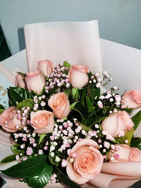 beautiful bouquet of roses and peonies on a white background