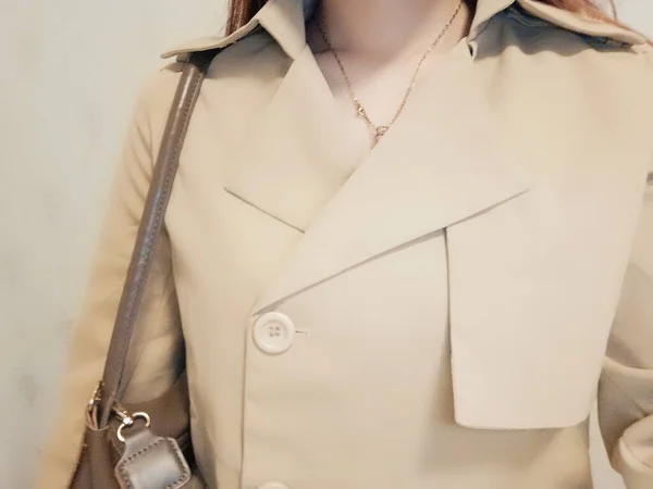 fashion mannequin in a coat with a white background