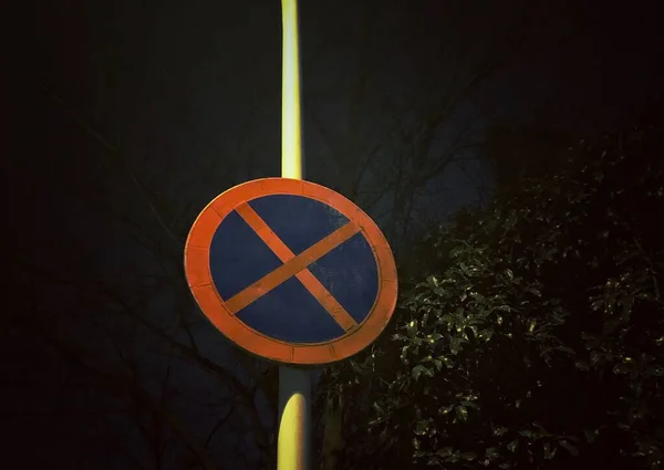 road sign with a red warning symbol