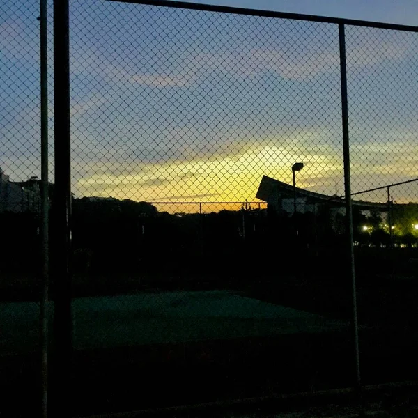 silhouette of a football field