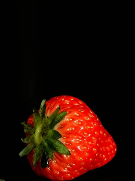 strawberry with a black background