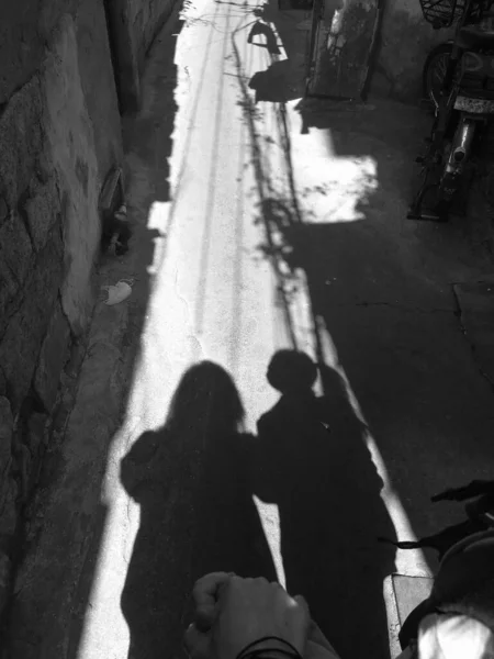 black and white photo of a couple in the city