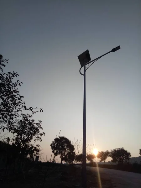 street lamp on the background of the sunset