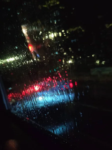 blurred background of car window with lights