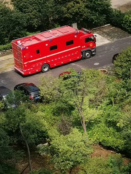 red fire car on the road