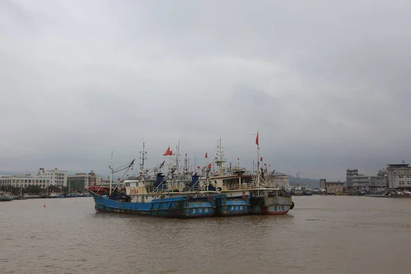 the ship is fishing on the river bank