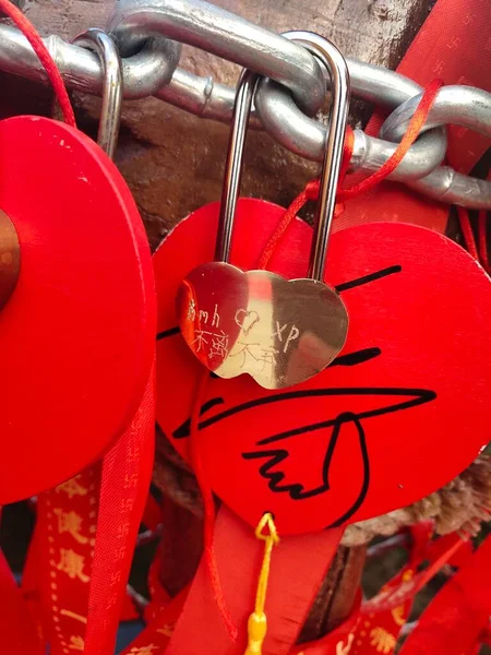 red heart with padlock on the background of the eiffel tower