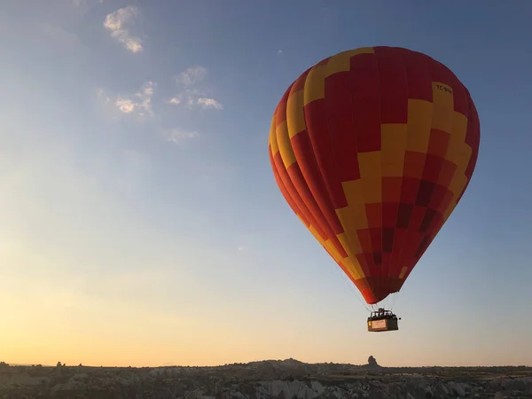 hot air balloon in the mountains