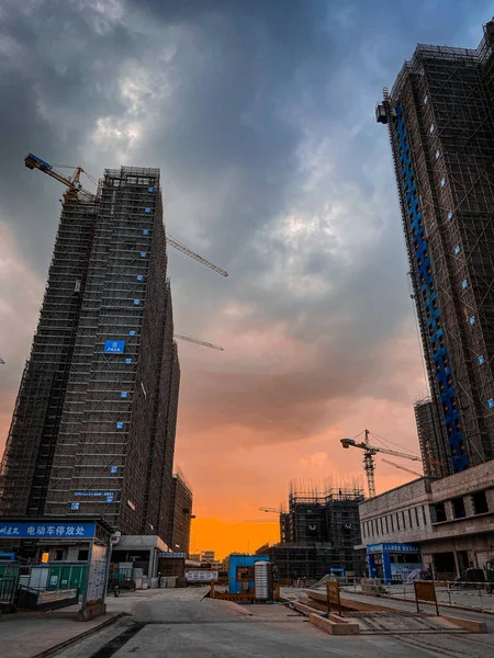 construction site with cranes and skyscrapers