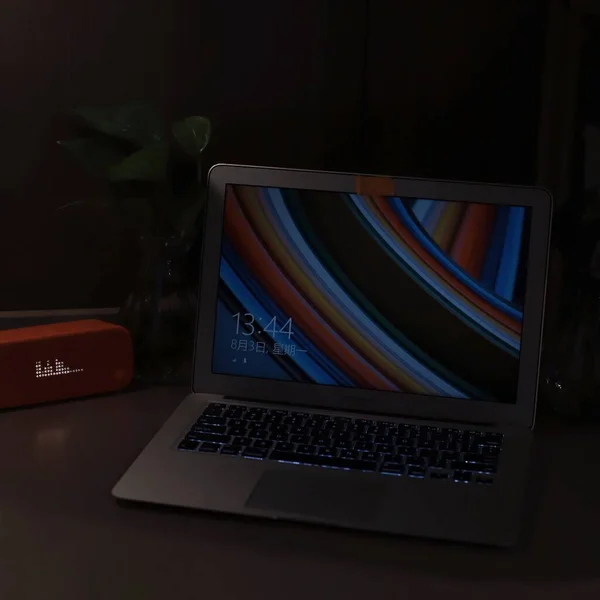 laptop with a computer and a red screen