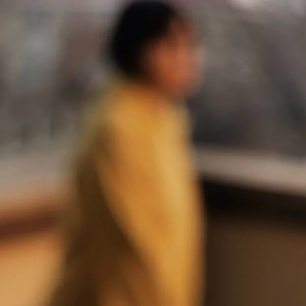 blurred background of a young woman in a restaurant