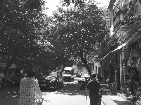 black and white photo of a young man in the city