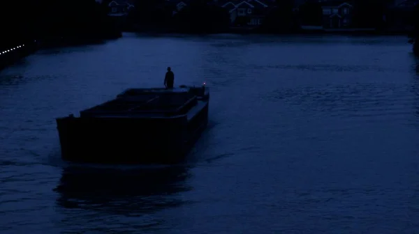 silhouette of a man in a boat