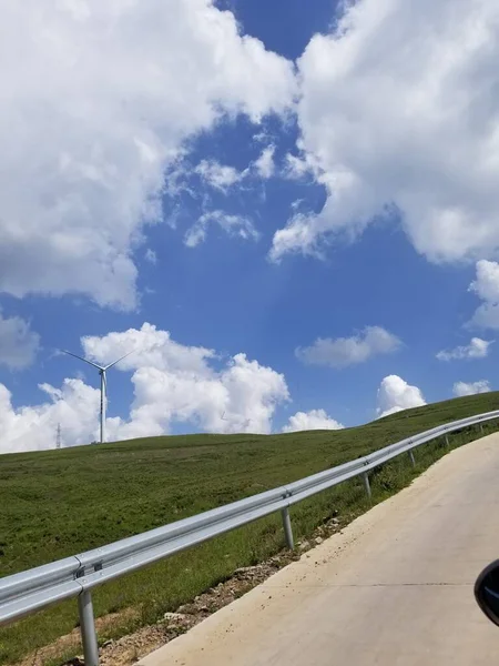 beautiful landscape with a road and a blue sky