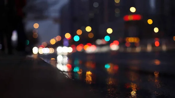 blurred bokeh background of city street with lights