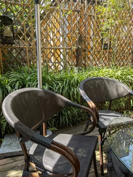 outdoor patio chair with umbrella and chairs